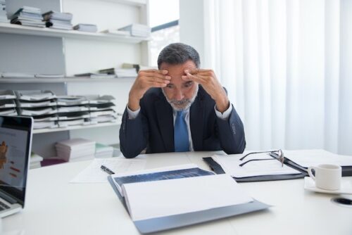 man stressing about filing mistakes