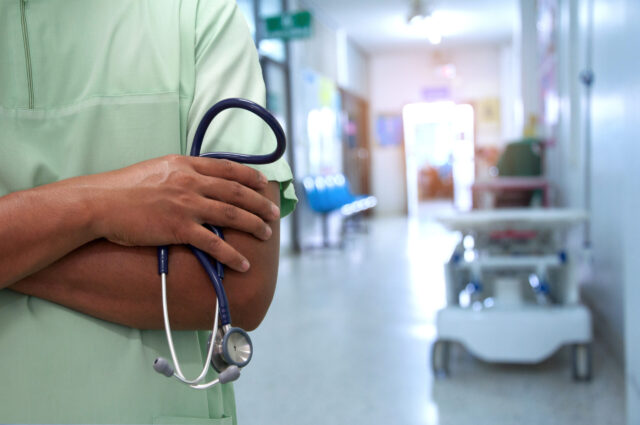 medical professional with stethoscope emergency room