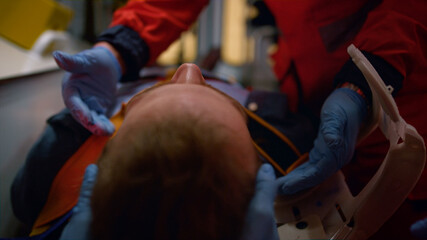 person being medically examined in ambulance