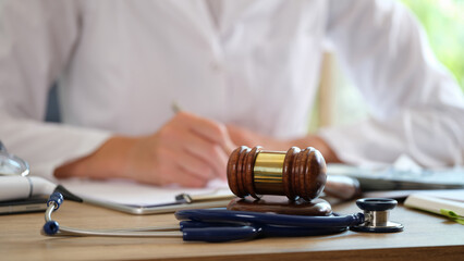 gavel with lawyer and stethescope
