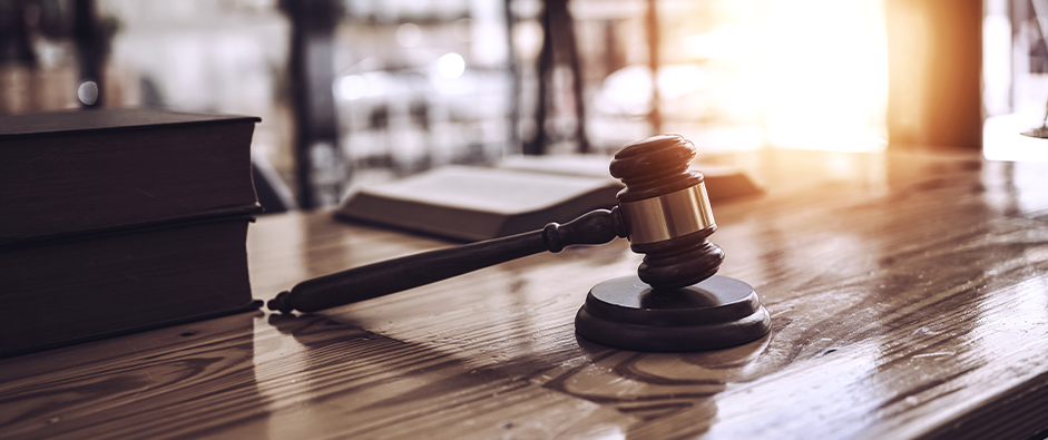 Close up wooden gavel and book of law put on desk table