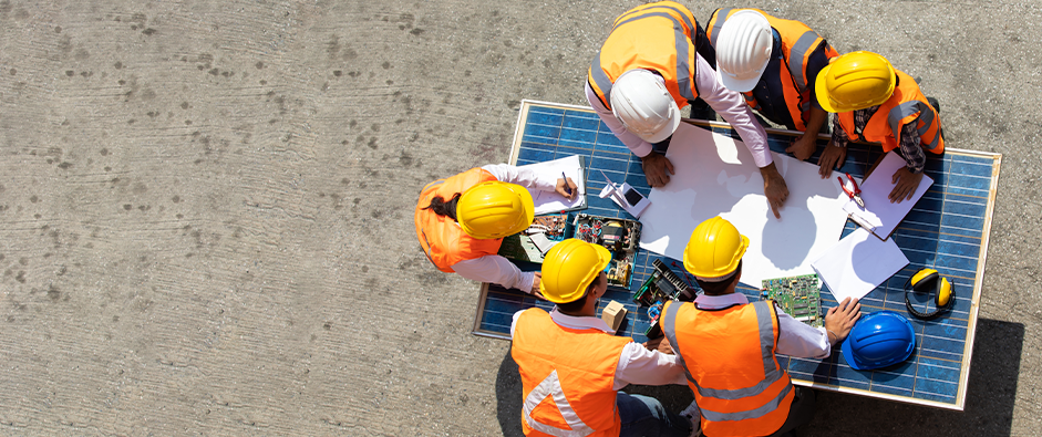 Group of professional engineering people wearing hardhat safety helmet meeting