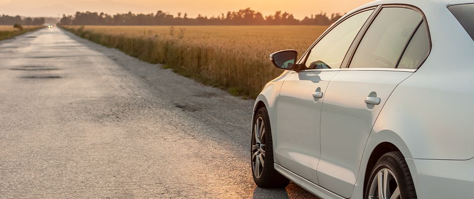 white car on country road