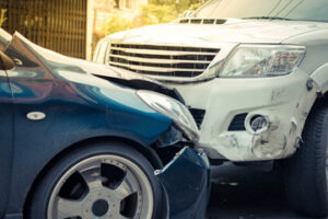 two cars collided with front damage