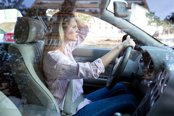 woman looking angry in car