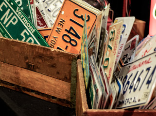 bucket of license plates from different states