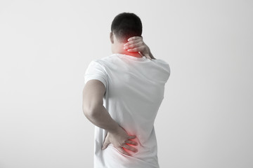 man with neck and back pain