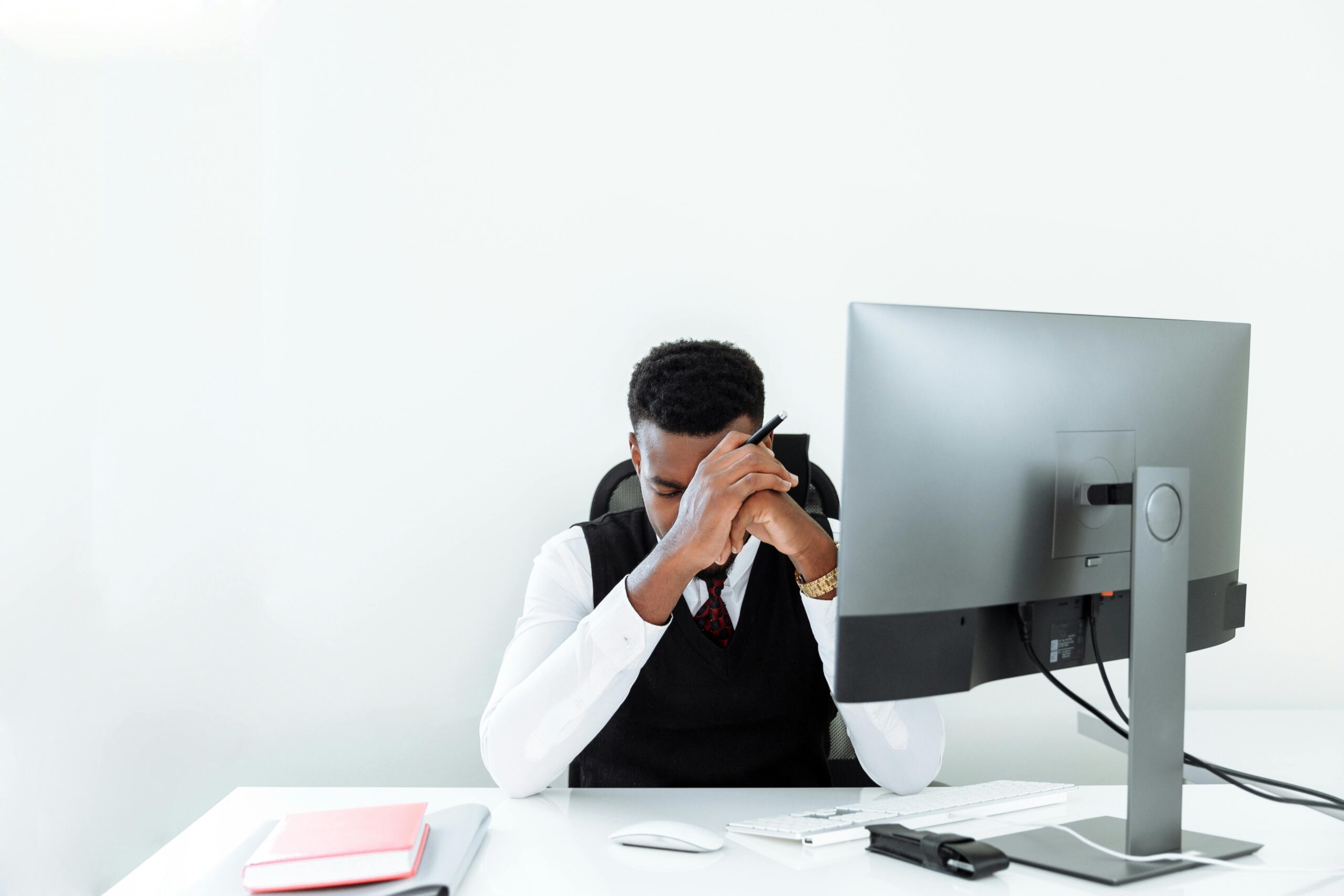 stressed man at computer