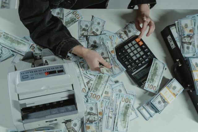 person calculators and money