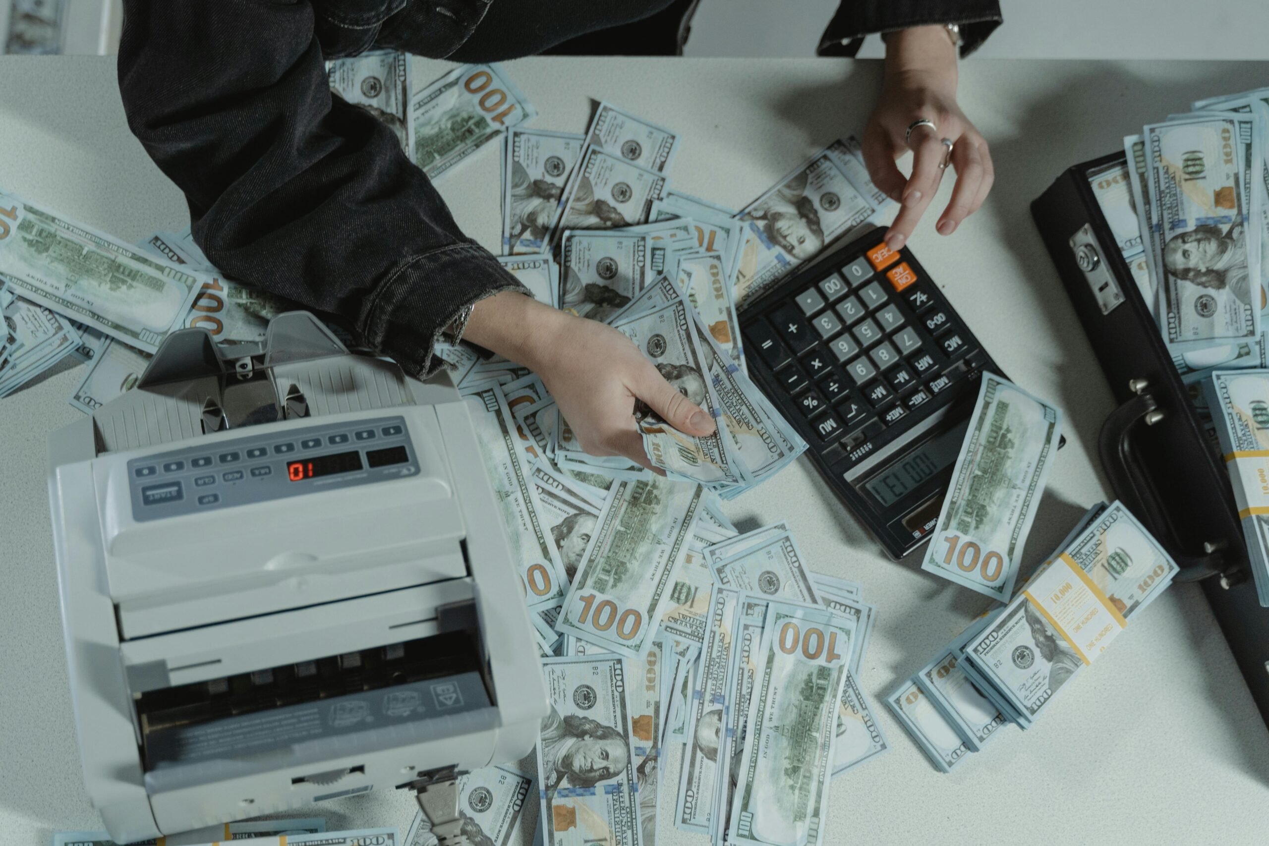 person calculators and money